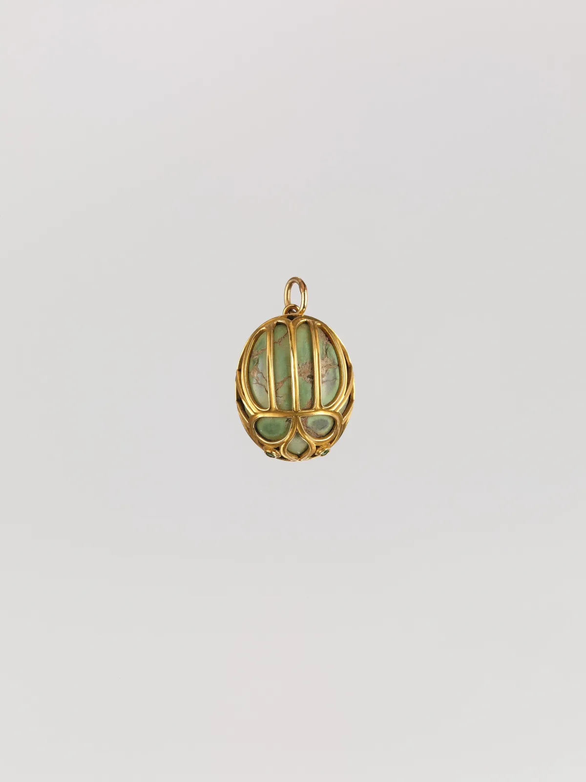 Marcus and Co. gold and plique-à-jour enamel pendant set with a central gemstone surrounded by floral wirework